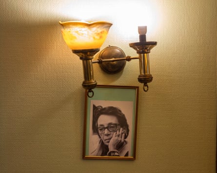 A portrait of the writer Marguerite Duras hangs in Café des Sports.
