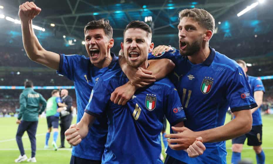 Jorginho (centre) celebrates with Matteo Pessina and Domenico Berardi after scoring the winning penalty in the Euro 2020 semi-final shootout against Spain