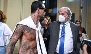 Italian television personality Fabrizio Corona and lawyer Ivano Chiesa at the Sophia Nubes show in Milan on Tuesday.