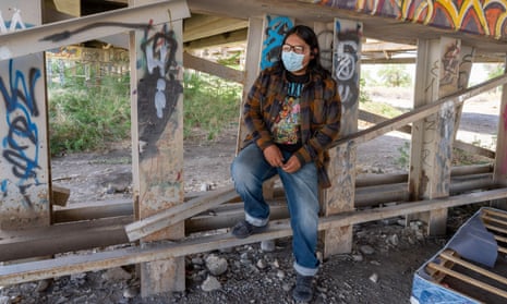 Navajo high school student Evan Allen, shown here beneath the US Highway 64 bridge in Shiprock, attended school all year sitting in a truck on a remote hill – the only place he could get a decent internet connection.
