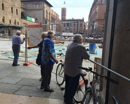 Men watching paving works in Bologna