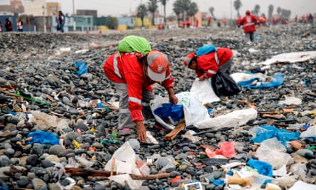In 2016, the world produced 242m tonnes of plastic waste. Pictured below, volunteers collect plastic rubbish from a beach in Lima, Peru.
