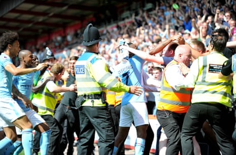 Raheem Sterling, of Manchester City scores a late winner and celebrates