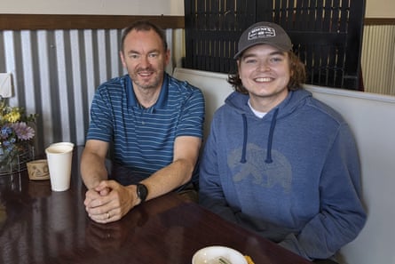 Two men smile