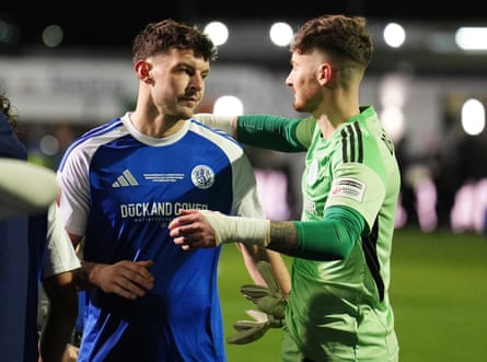 Macclesfield’s Sam Heathcote is consoled by Max Dearnley after the fourth-round match.