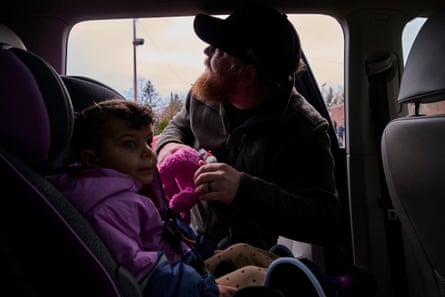 A father drops his daughter off at daycare in Minneapolis, Minnesota.