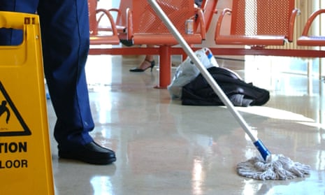 Hospital cleaner mopping floor