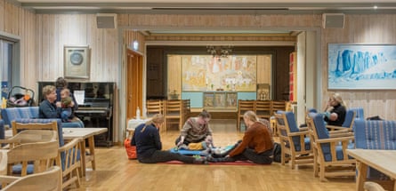 A group of parents and children participate in Baby Sang, a postnatal musical group, to piano music supplied by Jovna Zakharias Dunfjell, the church musician.
