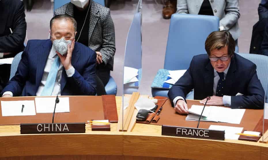 China’s ambassador to the UN, Zhang Jun (left), listens to French ambassador to the UN, Nicolas de Riviere, during the United Nations Security Council meeting on 11 March.