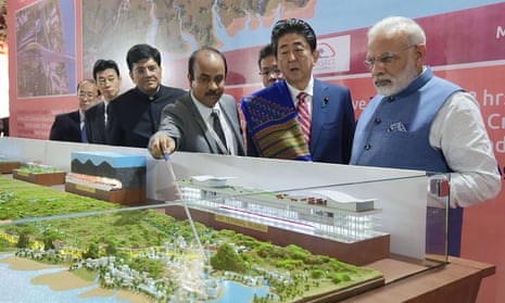 Narendra Modi and Shinzō Abe look at a railway station model at a ground-breaking ceremony for the Mumbai-Ahmedabad high speed rail project in Ahmedabad. 