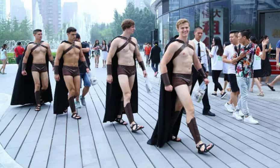 Men dressed as Spartan warriors to promote a salad eatery.