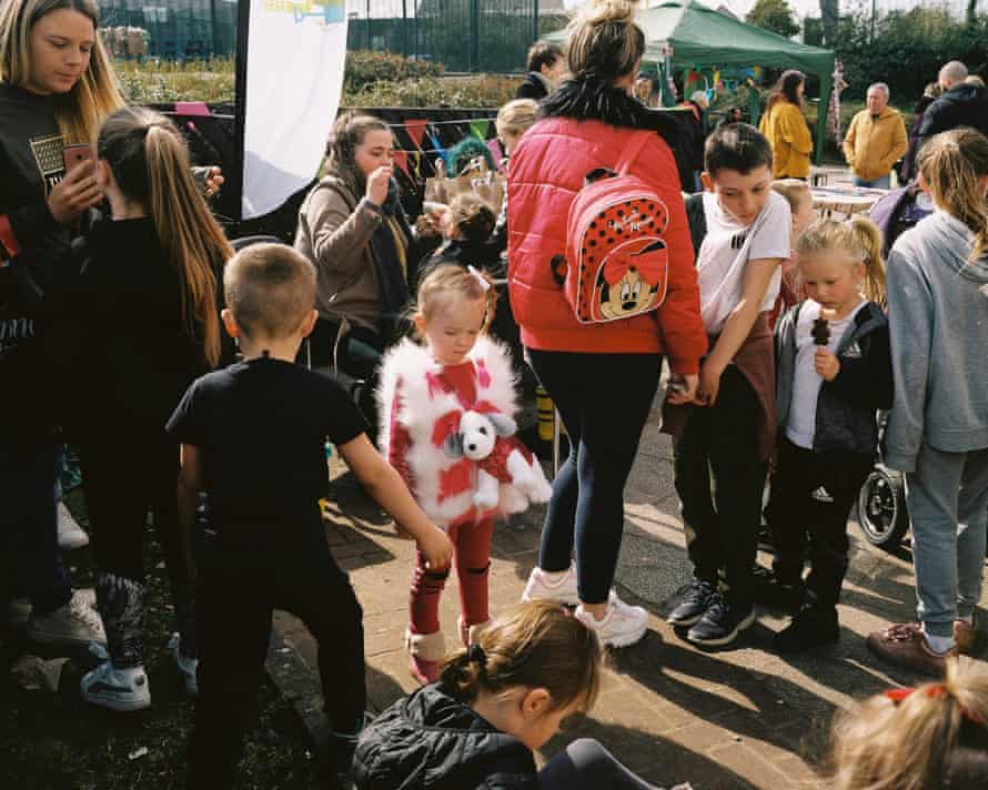 Children wait in the queue for face painting, at the Women Against Capitalism ‘Care and Share’ event, Castlemilk.