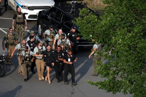 MMA fighter Sean Strickland is escorted out of the UFC Freedom 250 fan fest on the Ellipse by US Secret Service and other law enforcement officers ahead Sunday’s fights.