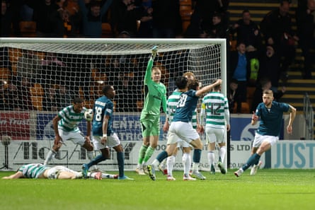 Liam Gordon (right) races away after scoring for Motherwell.