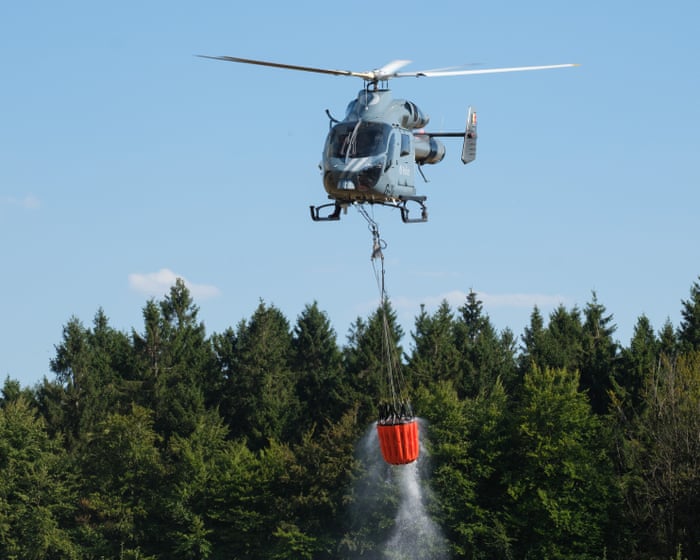 Greek island wildfire kills two people as helicopters called in to tackle Belgium forest blaze