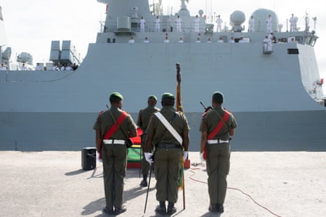 A Vanuatu Mobile Force honour guard stands in front of a People’s Liberation Army of China navy frigate on a four-day friendly visit to Vanuatu. 