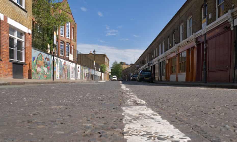 A white line running down the centre of an empty Colombia Road in east London