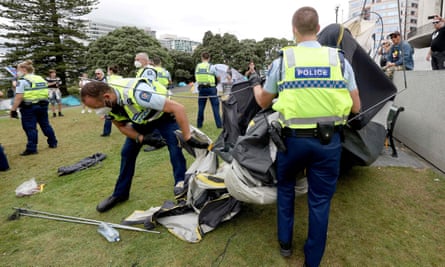 Police pack up a tent at parliament grounds in Wellington.