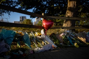 A heart shaped balloon is left among floral tributes for Sabina Nessa by Cator Park