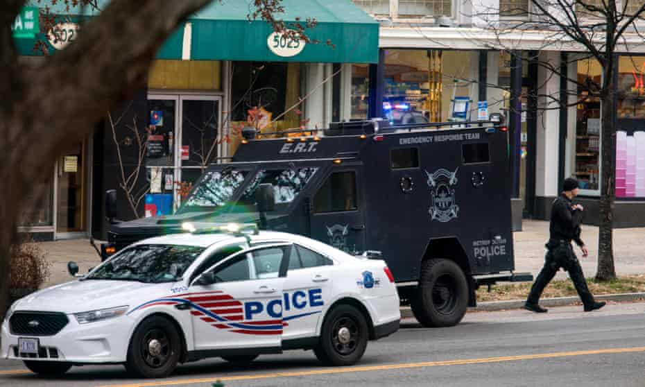 Police surround Comet Ping Pong, a pizza restaurant Washington, DC that was the subject of a fake news story claiming it was the center of a child sex ring orchestrated by Hillary Clinton
