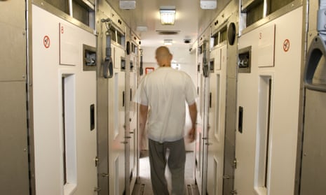 Prisoner walking along a prison corridor