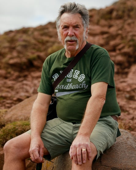 Dave McEwan, 71, Edinburgh, Western Australia sits for a portrait near the top of Arthurs seat an extinct volcano near Edinburgh city centre