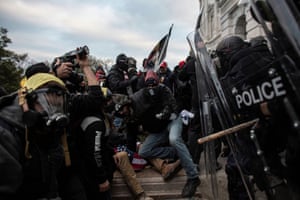 Pro-Trump mob clashes with police as they try to breach the US Capitol on 6 January.