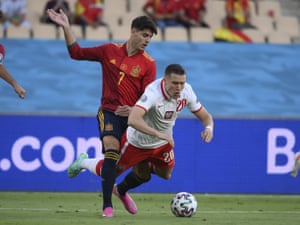 Poland’s Piotr Zielinski goes to ground after a challange from Spain’s Alvaro Morata.