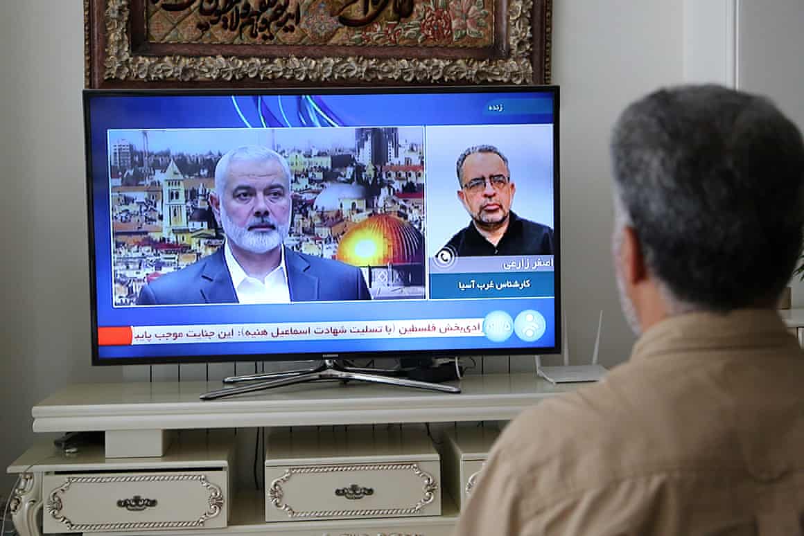 A man watches the news on TV