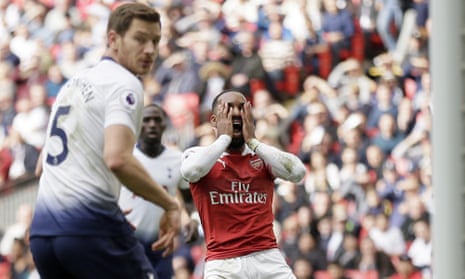 Arsenal’s Alexandre Lacazette, center, reacts after missing a chance to score.