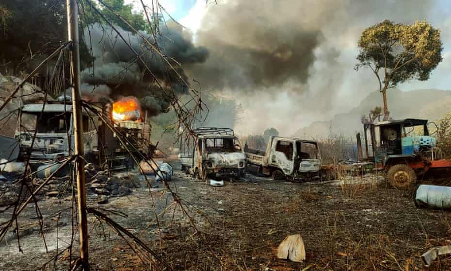 Smokes and flames billow from vehicles in Kayah state, Myanmar, after an attack by the junta on Christmas Eve.  