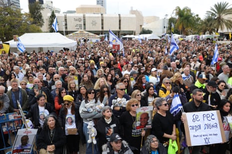 People watch the release of Israeli hostages on a big screen at Hostages Square in Tel Aviv, Israel, on Saturday.