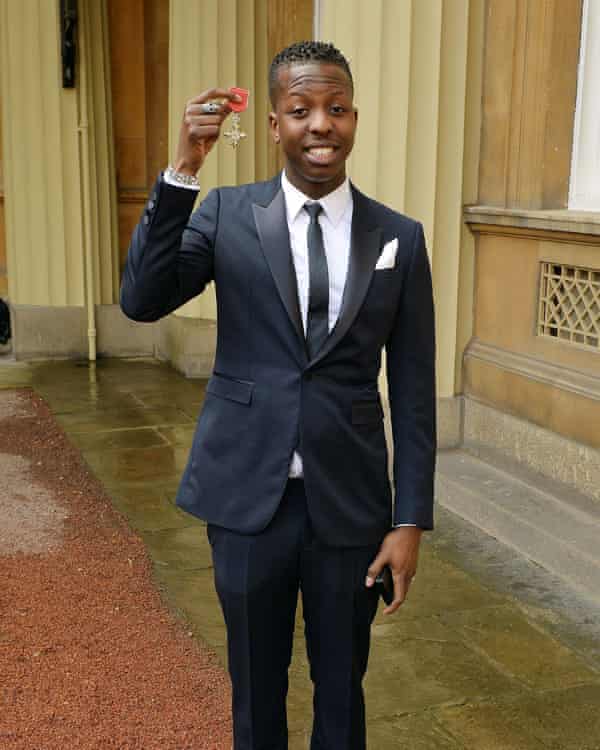 Jamal Edwards holding his MBE, March 2015.