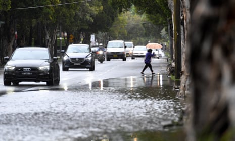 Cars approach flood waters in Sydney