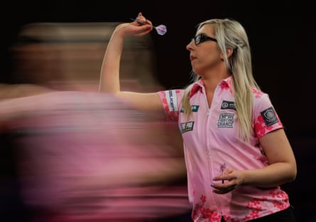 In a blurry shot, Fallon Sherrock prepares to throw a dart.
