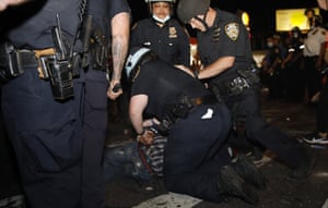 New York City police officers arrest someone during a protest in Brooklyn, New York, on 30 May 2020.