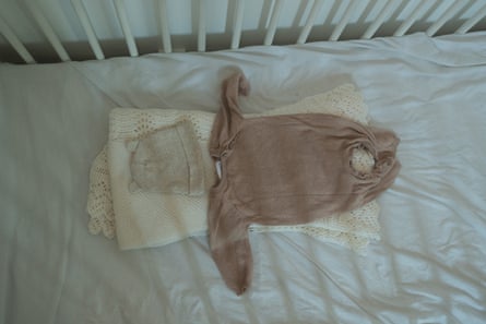 Zammi’s clothes in her empty cot