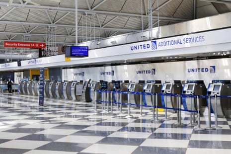 In this 25 June 2020 file photo, rows of United Airlines check-in counters at O’Hare International Airport in Chicago are unoccupied amid the coronavirus pandemic.