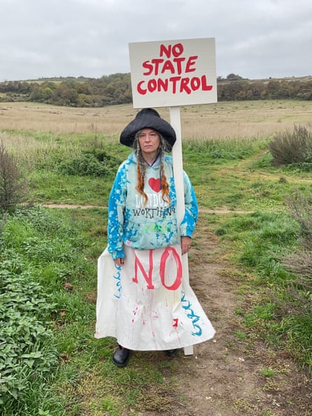 Delaine Le Bas holds a placard saying ‘No State Control’, and wears clothes with the words ‘Worthing’, ‘London’ and ‘No’.
