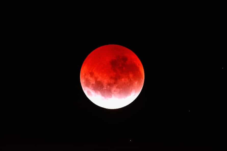 A blood red moon lights up the sky during a total lunar eclipse on April 4, 2015 in Auckland, New Zealand