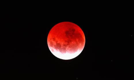 Lunar Eclipse Lights Up New Zealand Sky<br>AUCKLAND, NEW ZEALAND - APRIL 04: A blood red moon lights up the sky during a total lunar eclipse on April 4, 2015 in Auckland, New Zealand. The shortest total lunar eclipse, or “blood moon”, of the century will last just a few minutes. (Photo by Phil Walter/Getty Images)