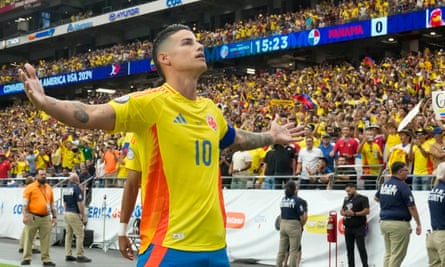 James Rodríguez celebrates with the Colombia fans after scoring against Panama