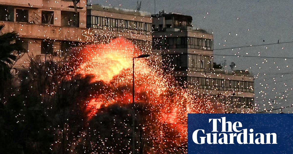 Moment building in central Beirut collapses after Israeli strike – video