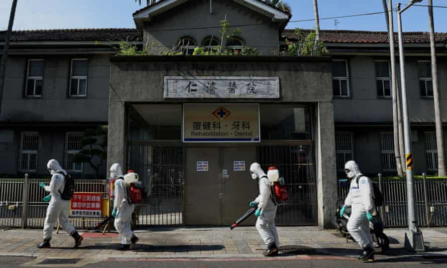 Soldiers spray disinfectant in Wanhua district, Taipei