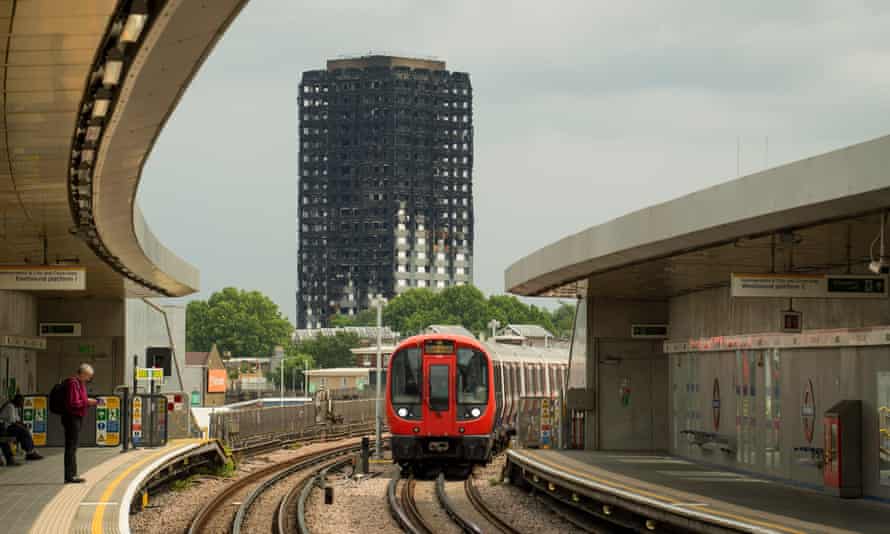 The charred remains of Grenfell Tower as seen from Wood Lane station in west London.