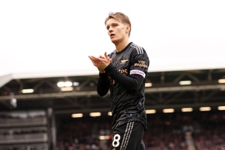 Martin Odegaard applauds the fans at full-time.