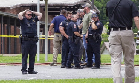 Police officers outside the Walnut Park elementary school in Gadsden, Alabama, after a fatal police shooting.