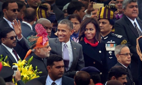 US President Barack Obama waves to the crowd flanked by Indian Prime Minister Narendra Modi and first lady Michelle Obama, as they leave at the end of India’s annual Republic Day parade in New Delhi.