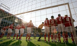 The referee lines up the wall for free-kick in the World Cup qualifier between Switzerland and the Faroe Island in September 2004.