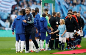 The teams and mascots greet before kick-off.
